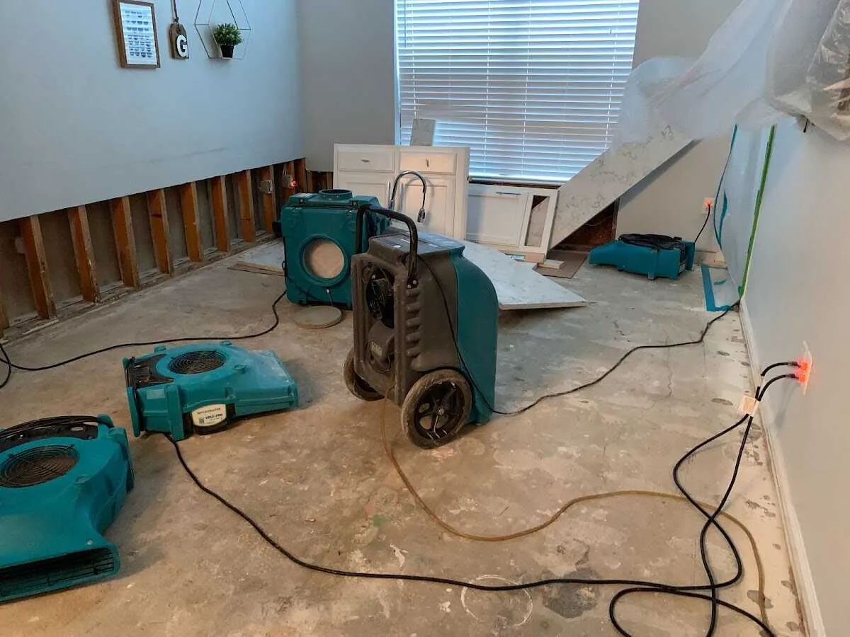Dehumidifier in flood-cut room for Water Damage Restoration in Ocean Pointe